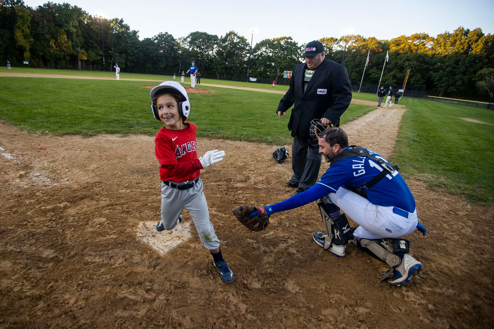 Mila Gagne, 7, did her part for the cause as she crossed home plate with a run.